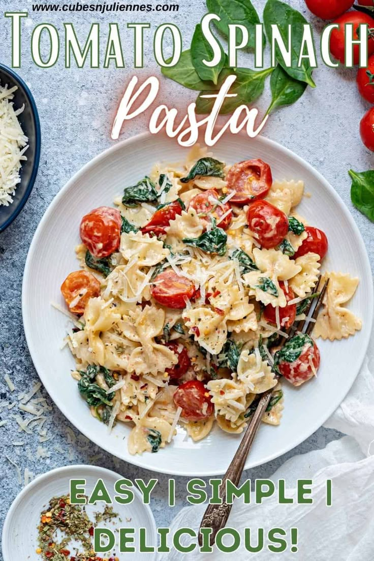 an image of a plate of pasta with tomatoes and spinach on the side text reads tomato spinach pasta easy simple delicious