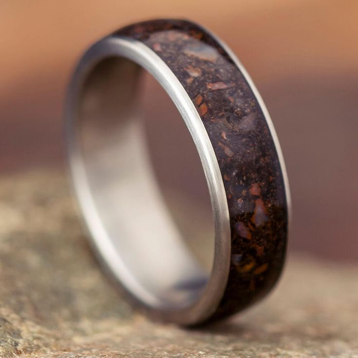 a wedding ring made out of antelope wood and silver plated in stainless steel