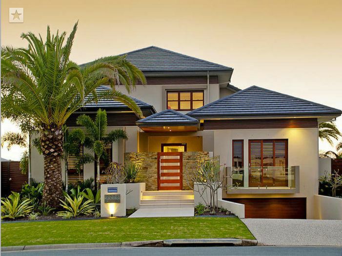 a house with palm trees in front of it