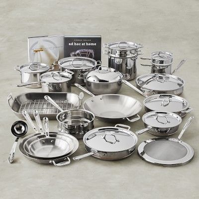 an assortment of stainless steel pots and pans