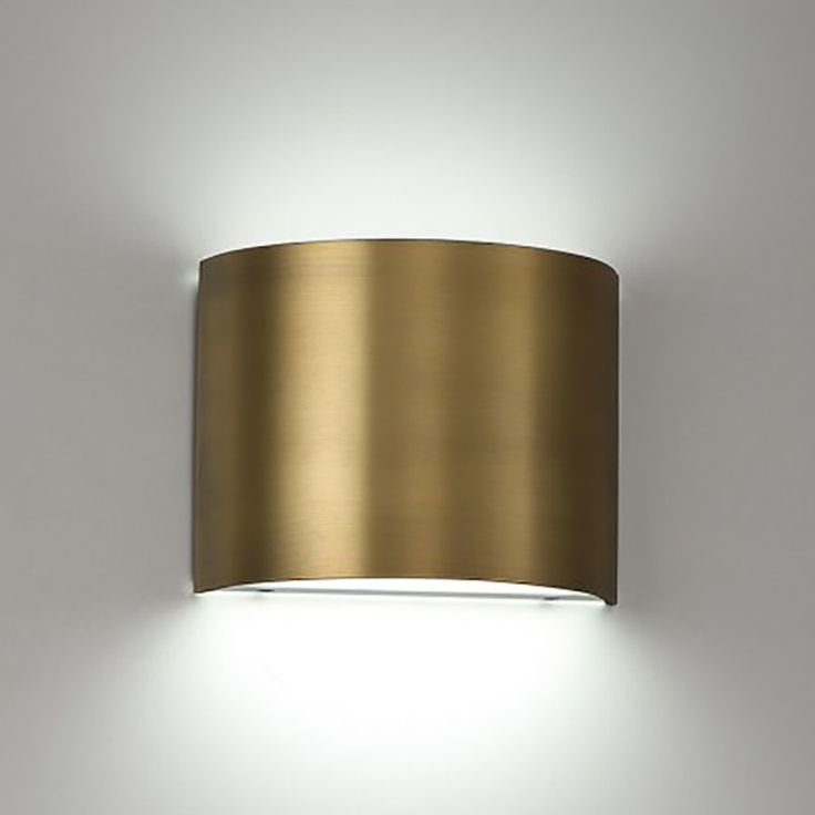 a light that is on the side of a wall with a white light behind it