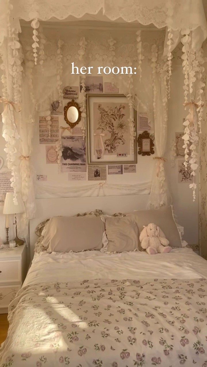 there is a bed with white sheets and decorations on the headboard, along with pictures above it