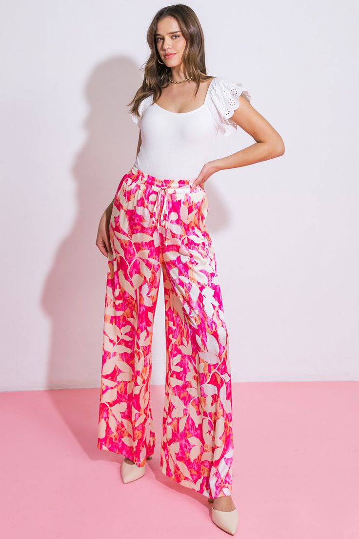 An exquisitely crafted woven pant, adorned with an elasticized waistband complete with a tasteful tacked tie and flowing wide leg design. Matching top IT12981Details:Self : 100% PolyesterLining : 100% PolyesterSize & Fit- Model is 5`8" And Wearing Size Small- Measurements Taken From Size Small- Approx. Length: 43" Spring Wide Leg Ankle-length Pants With Tie Waist, Trendy Spring Wide Leg Pants With Tie Waist, Trendy Wide Leg Pants With Tie Waist For Spring, Spring Ankle-length Wide Leg Pants With Tie Waist, Pink Tie Waist Vacation Bottoms, Pink Tie Waist Bottoms For Vacation, Spring Wide Leg Tie Waist Pants, Trendy Wide Leg Pants With Tie Waist, Spring Straight Pants With Tie Waist