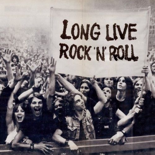 an old black and white photo of people holding up a sign that says long live rock'n'roll