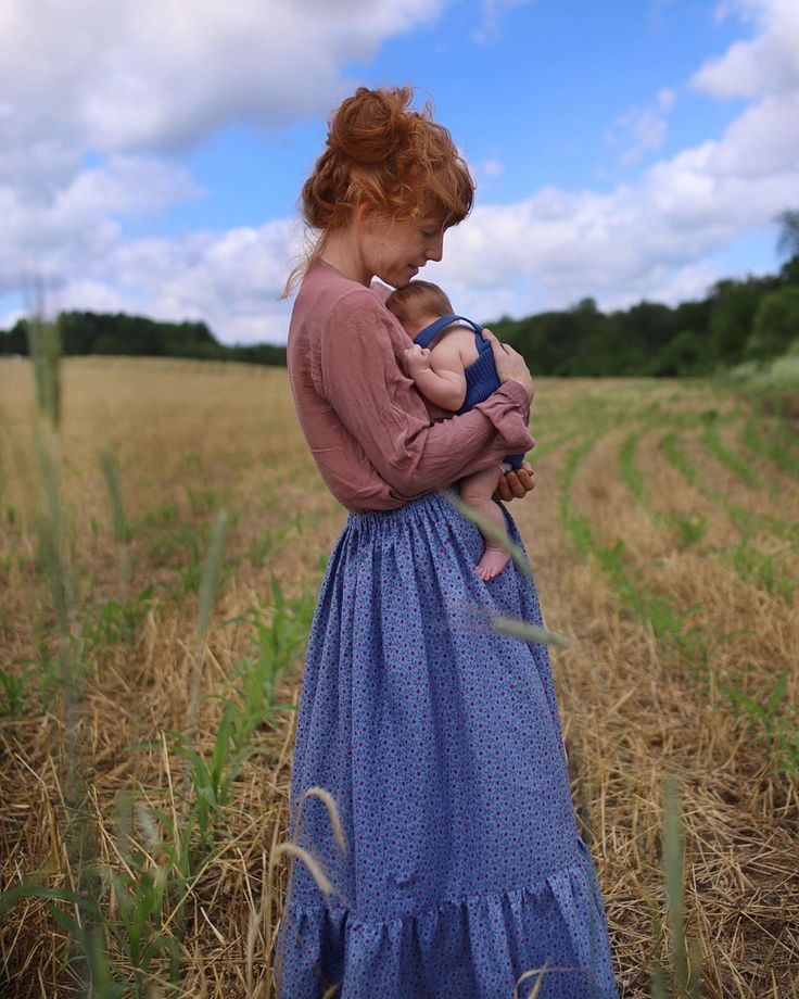 Kelly Havens Stickle (@kellyhavensohio) posted on Instagram: “When I first came to Ohio when I was 18, my mom and I drove under an aqua sky with clouds tainted a perfect periwinkle. I would have never…” • Jun 15, 2020 at 6:08pm UTC Diy Maxi Skirt, Holding A Baby, Farm Dress, Sky With Clouds, Kids Inspo, Cottage Aesthetic, Holding Baby, Kids Wardrobe, Sky And Clouds