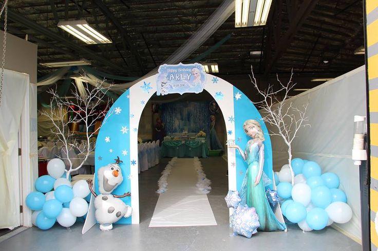 a frozen princess themed birthday party with balloons and decorations for the entrance to an event