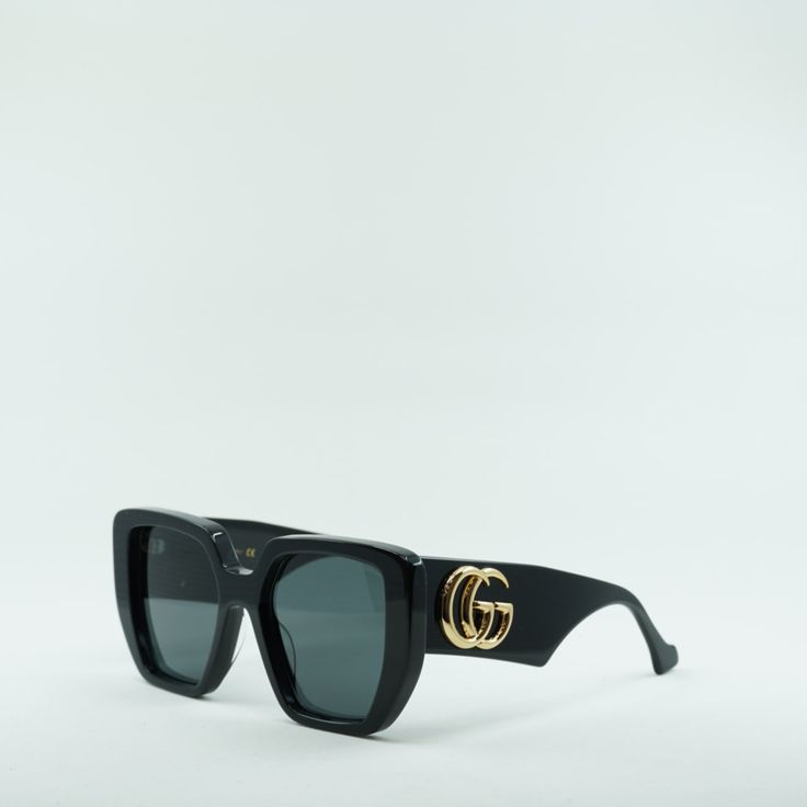 Welcome to OSSA FRAMES, where luxury meets style with the Gucci GG0956S 003 Black/Grey sunglasses. Designed by the iconic fashion house Gucci, these sunglasses are the perfect accessory for any fashion-forward woman. Crafted with precision and attention to detail, these sunglasses feature a sleek black acetate frame that exudes sophistication. The square shape adds a modern touch, while the full rim design provides a classic look that never goes out of style. The grey lenses offer 100% UV protec Gucci Designer Cat Eye Sunglasses With Gradient Lenses, Designer Gucci Polarized Sunglasses, Luxury Gucci Cat Eye Sunglasses For Summer, Gucci Luxury Cat Eye Sunglasses For Evening, Gucci Modern Square Frame Cat Eye Sunglasses, Luxury Black Cat Eye Sunglasses With Mirrored Lenses, Modern Gucci Cat Eye Sunglasses With Uv Protection, Modern Gucci Cat Eye Square Frame Sunglasses, Gucci Designer Cat Eye Sunglasses With Mirrored Lenses