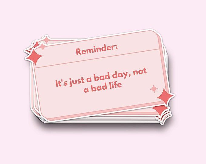 a pink reminder sticker that says it's just a bad day, not a bad life