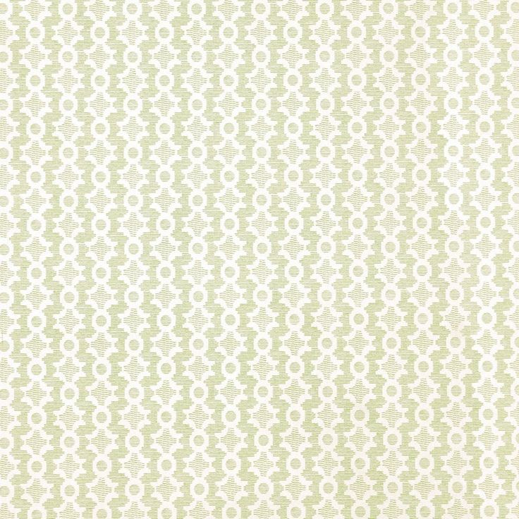 a green and white wallpaper with small circles on the back ground, as well as an oval design