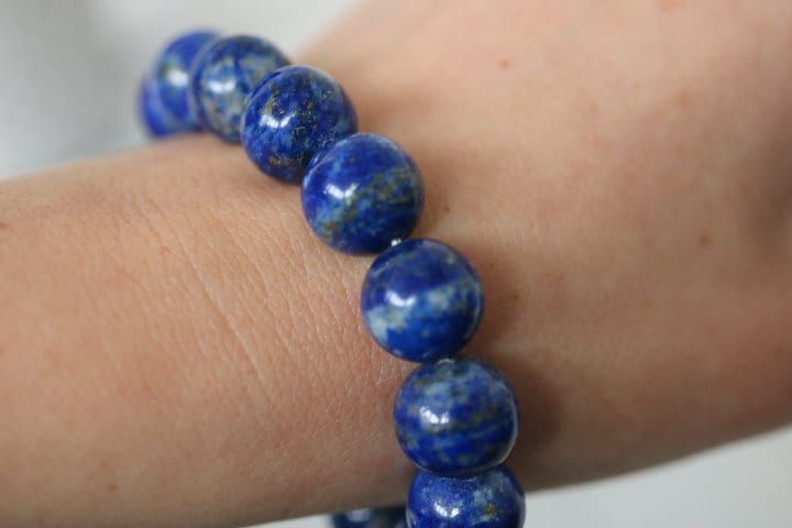 This one of a kind Lapis Lazuli bead bracelet has been handmade in our workshop.  Lapis Lazuli is one of the most sought after stones in use since man's history began. Its deep, celestial blue remains the symbol of royalty and honour, gods and power, spirit and vision. It is a universal symbol of wisdom and truth. It is a powerful crystal for activating the higher mind and enhancing intellectual ability. It stimulates the desire for knowledge, truth and understanding, and aids the process of lea Polished Beads Lapis Lazuli Bracelets, Polished Beads Lapis Lazuli Round Bracelets, Round Lapis Lazuli Bracelets With Polished Beads, Natural Lapis Lazuli Bracelets, Lapis Lazuli Beaded Bracelets With Polished Round Beads, Hand-strung Lapis Lazuli Spiritual Bracelets, Handmade Lapis Lazuli Bracelets For Meditation, Lapis Lazuli Beaded Bracelets For Healing, Spiritual Lapis Lazuli Round Beads Bracelets