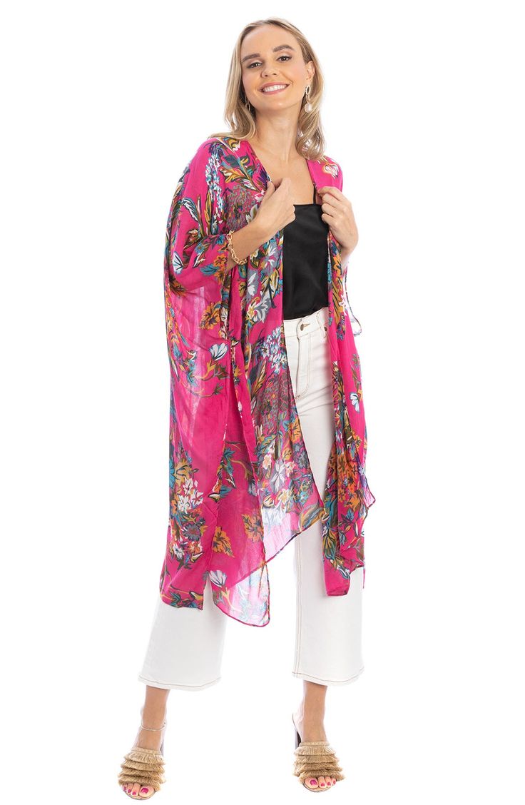 Love to layer in this eclectic long ruana styled in an ultra-comfortable, drapey silhouette and colorful floral pattern that is signature to Saachi's artisanal inspired brand. 34" x 44" Open front Short sleeves 100% rayon Hand wash cold, line dry Imported Model stats: 5'10", 32" bust, 25" waist, 36" hip. Model is wearing size OS. Casual Beach Shawl For Spring, Multicolor Floral Print Open Front Outerwear, Bohemian Floral Print Outerwear, Multicolor Open Front Outerwear With Floral Print, Spring Beach Outerwear With Boho Print, Boho Print Outerwear For Beach In Spring, Boho Print Outerwear For Spring Beach, Spring Boho Print Outerwear For Beach, Spring Vacation Bohemian Shawl