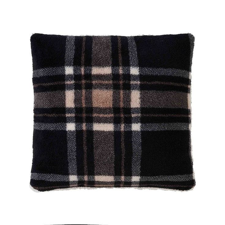 a black and white plaid pillow on a white background