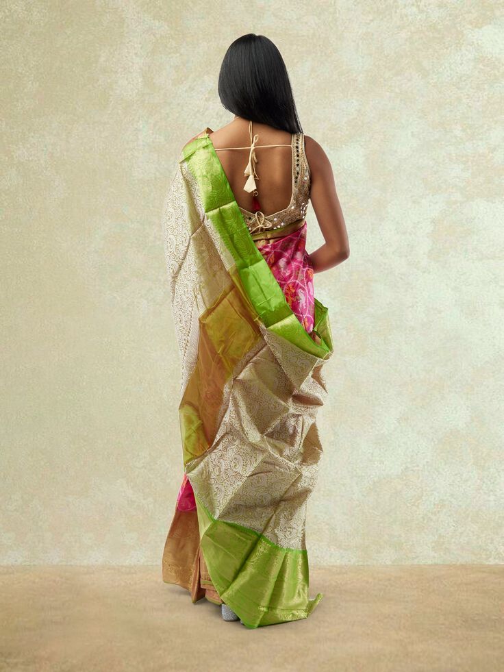 Embrace traditional elegance with our Pink and Green Fancy Patola Saree from the Sarees collection. This exquisite saree features a stunning combination of pink and green colors in a fancy Patola design, exuding grace and charm. The intricate detailing and vibrant hues make it a perfect choice for festive occasions and special events. Care Instructions: Dry clean only to maintain the fabric's quality and colors. Pink Tissue Silk Sharara For Transitional Season, Designer Multicolor Tissue Silk Pre-draped Saree, Pink Tissue Silk Pre-draped Saree With Self Design, Designer Chanderi Dupatta With Tilla, Pink Tissue Silk Pre-draped Saree In Traditional Drape, Festive Pre-draped Saree With Tilla In Traditional Drape, Festive Pre-draped Saree With Tilla, Pink Tissue Silk Pre-draped Saree, Pink Wedding Pre-draped Saree