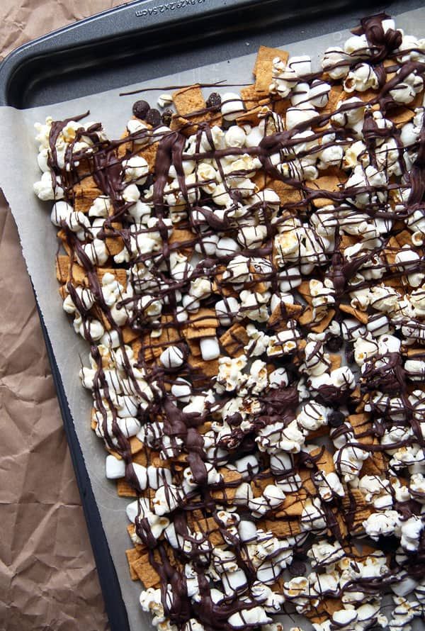 a cookie sheet covered in marshmallows and chocolate