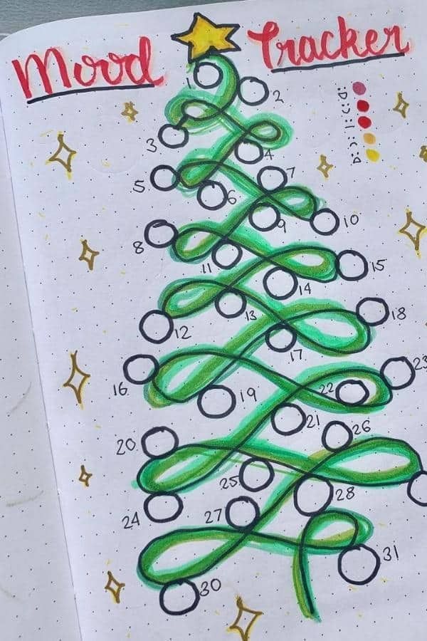 a christmas tree drawn on top of a notebook