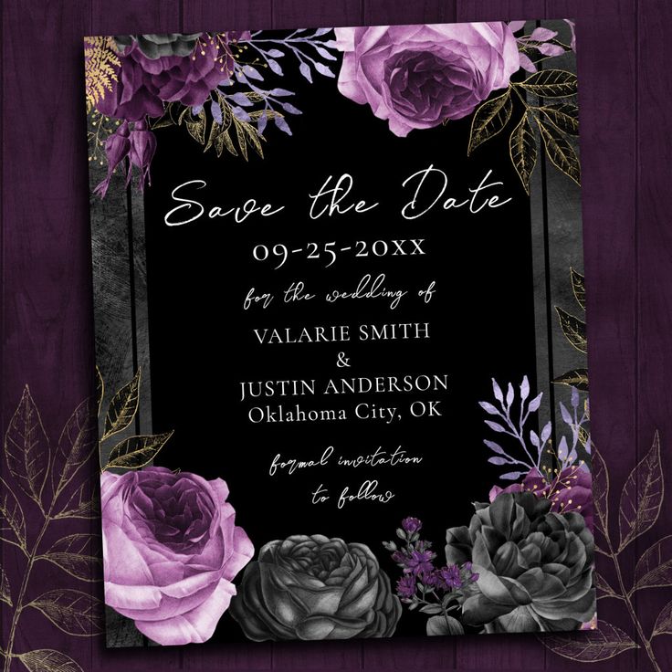 save the date card with purple roses and greenery on black paper, in front of a wooden background