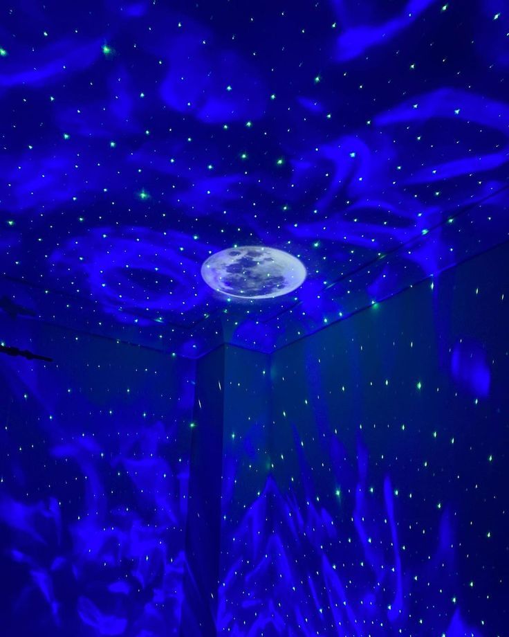 a room with blue lights and stars on the ceiling