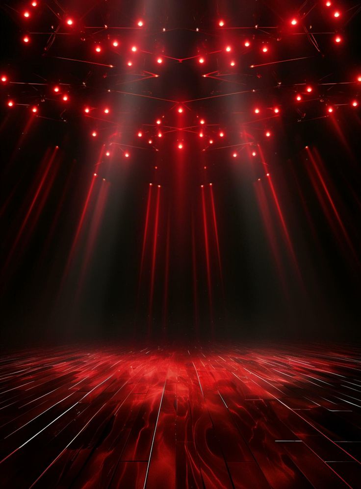 an empty stage with red lights and spotlights