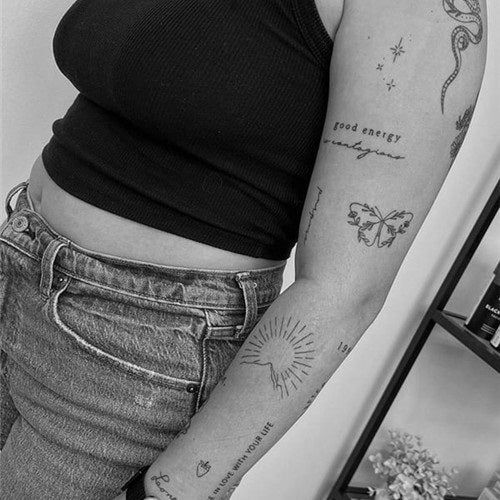 a woman with a tattoo on her arm