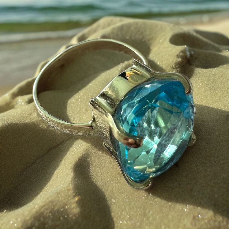 Introducing our stunning Aqua Marine Rings ! A timeless symbol of elegance and beauty! Dive into this world of mesmerizing blue hues that capture the essence of the ocean. Each ring is meticulously crafted to perfection, exuding a sense of luxury and sophistication. Whether you're looking for a statement for a special occasion or a daily reminder of the sea, our Aqua Marine Rings are the perfect choice. Let the refreshing energy of aqua marine inspire you and elevate your style to new heights. Make a splash with your jewelry collection and indulge in the allure of Aqua Marine Rings. Order yours today and experience the magic of the sea at your fingertips. Ocean-Inspired Beauty you must wear the ocean's hues on your finger! We offer them here at Amazonian Girl in 18K Gold and Silver. And In Timeless Topaz Jewelry For Formal Occasions, Formal Timeless Topaz Jewelry, Luxury Blue Topaz Round Jewelry, Luxury Round Blue Topaz Jewelry, Oval Blue Topaz Ring With Diamond Cut, Elegant Polished Topaz Ring For Formal Occasions, Blue Oval Diamond Ring With Polished Finish, Oval Blue Diamond Ring With Polished Finish, Luxury White Gold Ring With Aquamarine