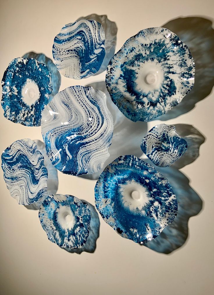 blue and white glass pieces on a table