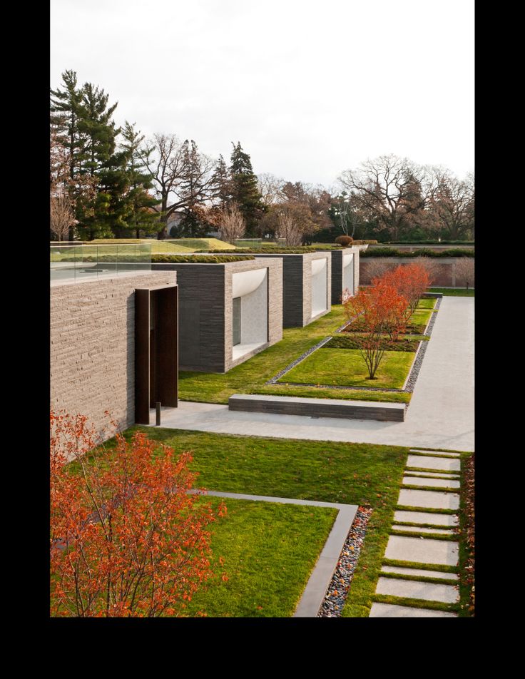 an outdoor courtyard with grass and trees