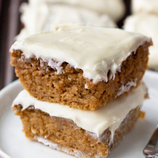 two pieces of cake sitting on top of a white plate