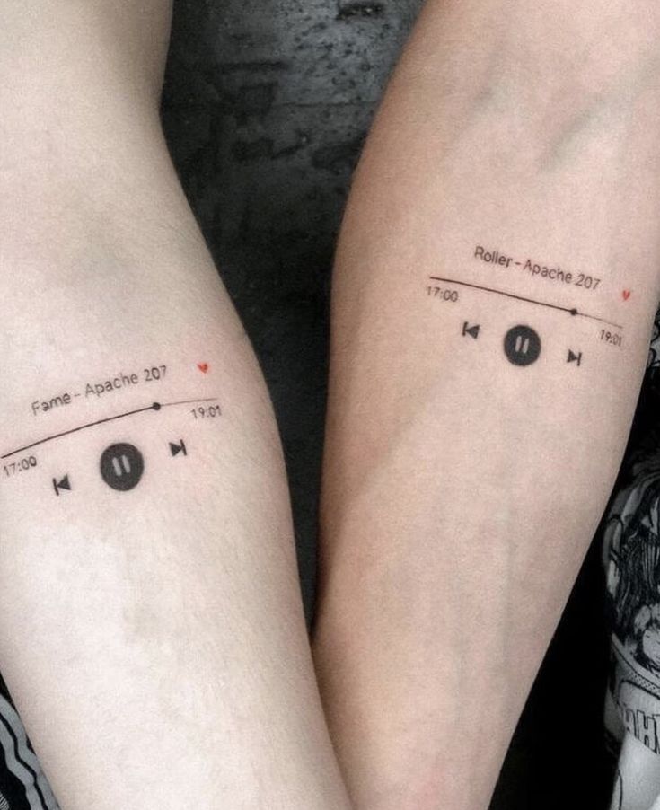 two people with matching tattoos on their legs, one has music notes and the other has headphones