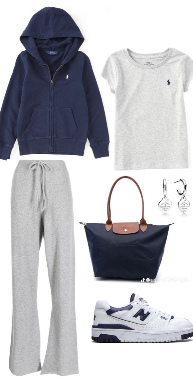 a woman wearing grey sweatpants and blue hoodie is shown with her handbag