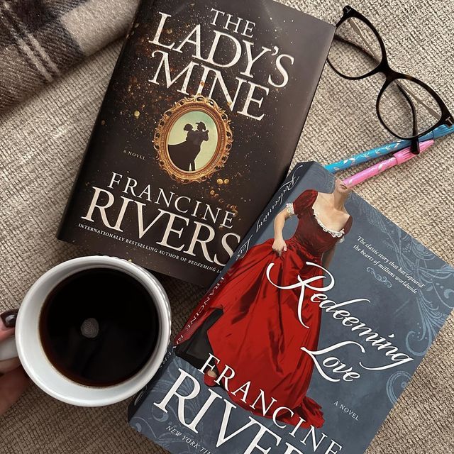 the lady's mine by francine rivers is next to a cup of coffee