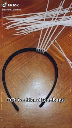 a close up of a headband on a wooden table with wires attached to it