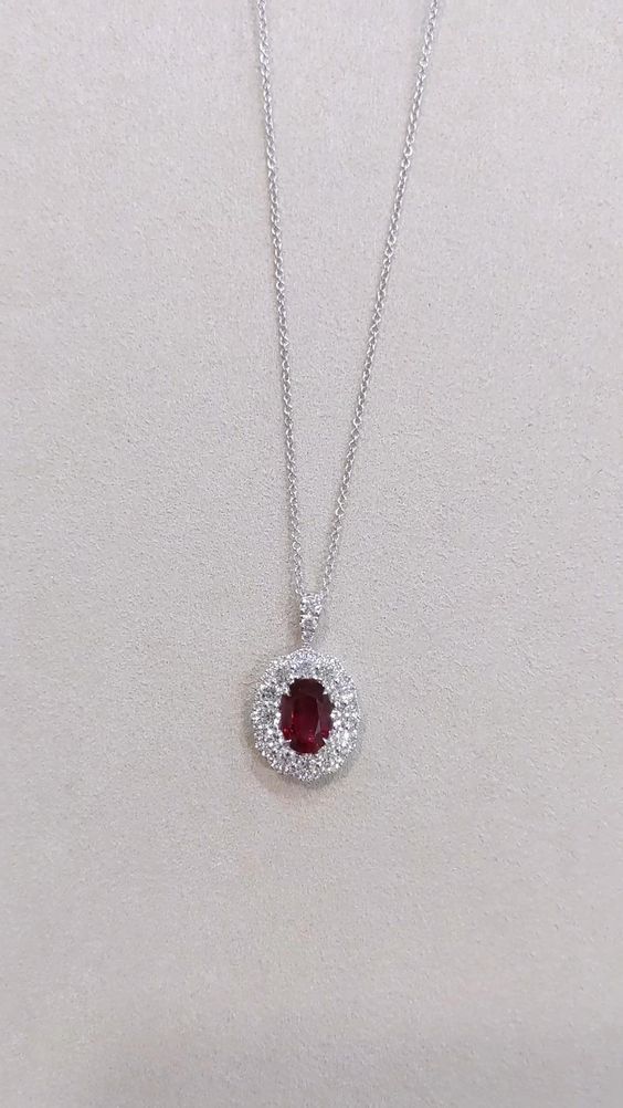 Discover the epitome of aesthetic splendor with our exquisite 2.16 Ct. Ruby and Diamond Pendant, meticulously crafted in luxurious 18K White Gold. This captivating piece features a radiant ruby gemstone complemented by dazzling diamonds, creating a harmonious masterpiece that exudes timeless elegance. Elevate your jewelry collection with this enchanting pendant that captures the essence of sophistication and beauty. 💎❤️✨ #RubyPendant #Diamonds #AestheticJewelry Elegant Red Oval Pendant Jewelry, Oval Ruby Necklace With Brilliant Cut, Luxury Red Oval Necklace, Exquisite Red Oval Necklaces, Exquisite Red Oval Necklace, White Gold Oval Ruby Necklaces, Red Oval Diamond Cut Necklace, Red Oval Necklace For Formal Occasions, Red Oval Necklaces For Formal Occasions