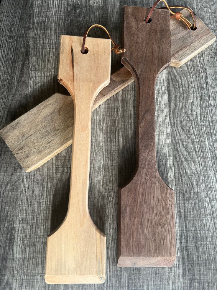 two pieces of wood sitting on top of a table