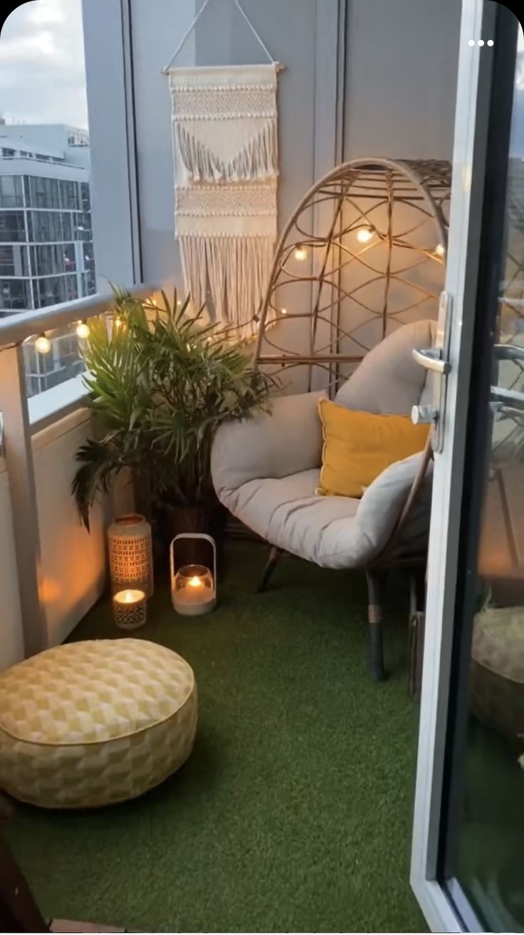 the balcony is decorated with plants and lights, including a hanging hammock chair