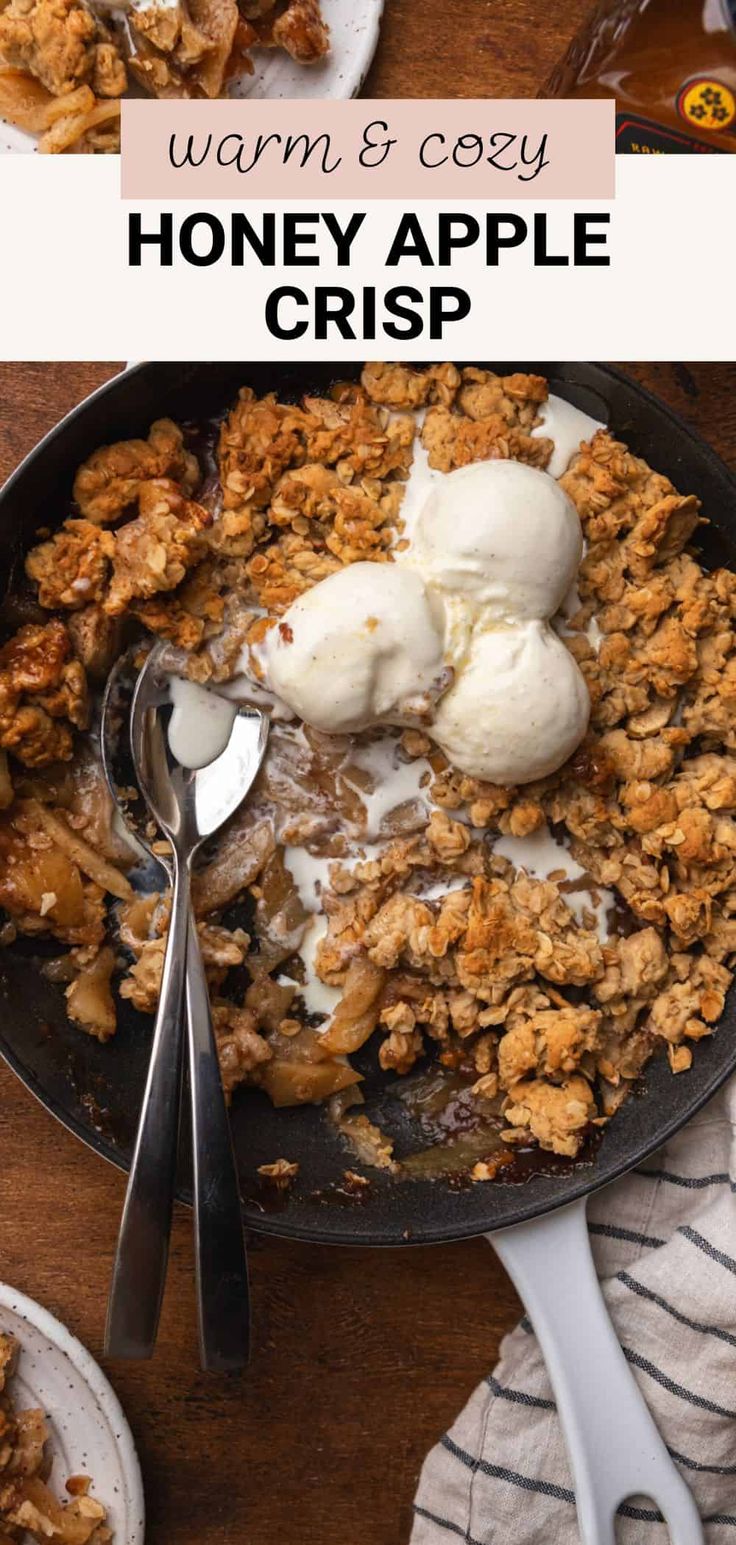 an apple crisp with ice cream on top in a cast iron skillet