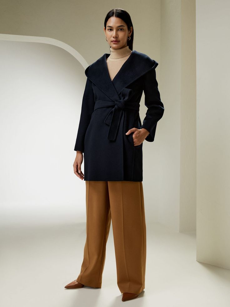 A staple for your fall and winter wardrobe, our cashmere-wool-blend coat is a versatile layering piece, with a built-in hood, suitable for outdoor activities on not so good days.
Matching belt, tied or not, accentuates waistline, transcending the seasons to become timeless. Women Wool Coat, Silk Comforter, Silk Nightwear, Silk Maxi Skirt, Silk Sheets, Camisole Set, Wool Tie, Merino Wool Cardigan, Belted Shorts