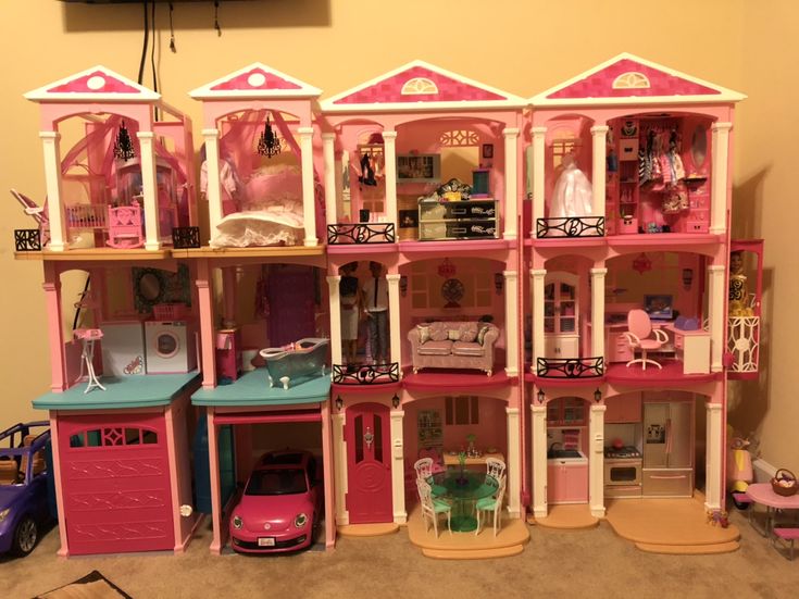 a large doll house with lots of furniture and accessories