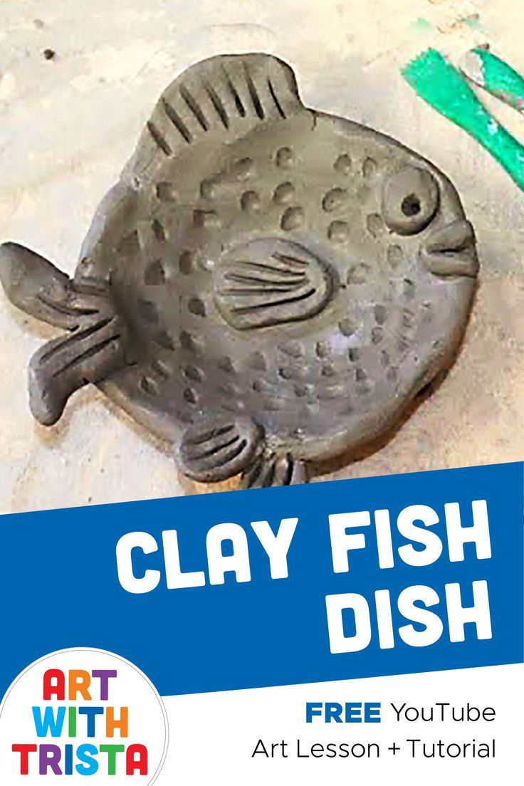 clay fish dish with green toothbrush next to it and the words clay fish dish