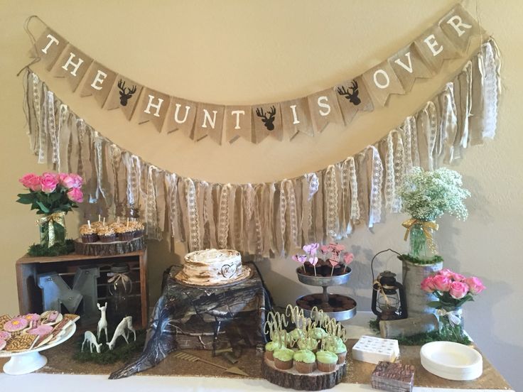 the dessert table is set up with cupcakes and cakes