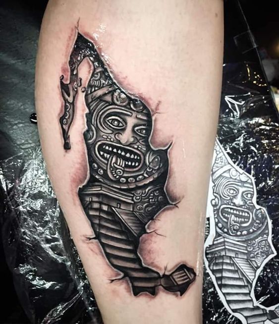 a tattoo on the leg of a person with a skeleton head and an arrow in it