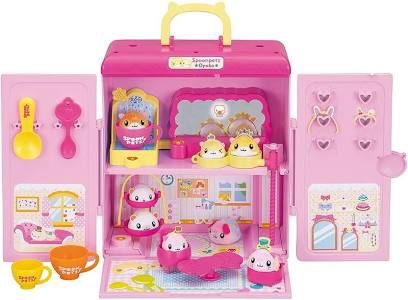 a pink toy kitchen with lots of accessories