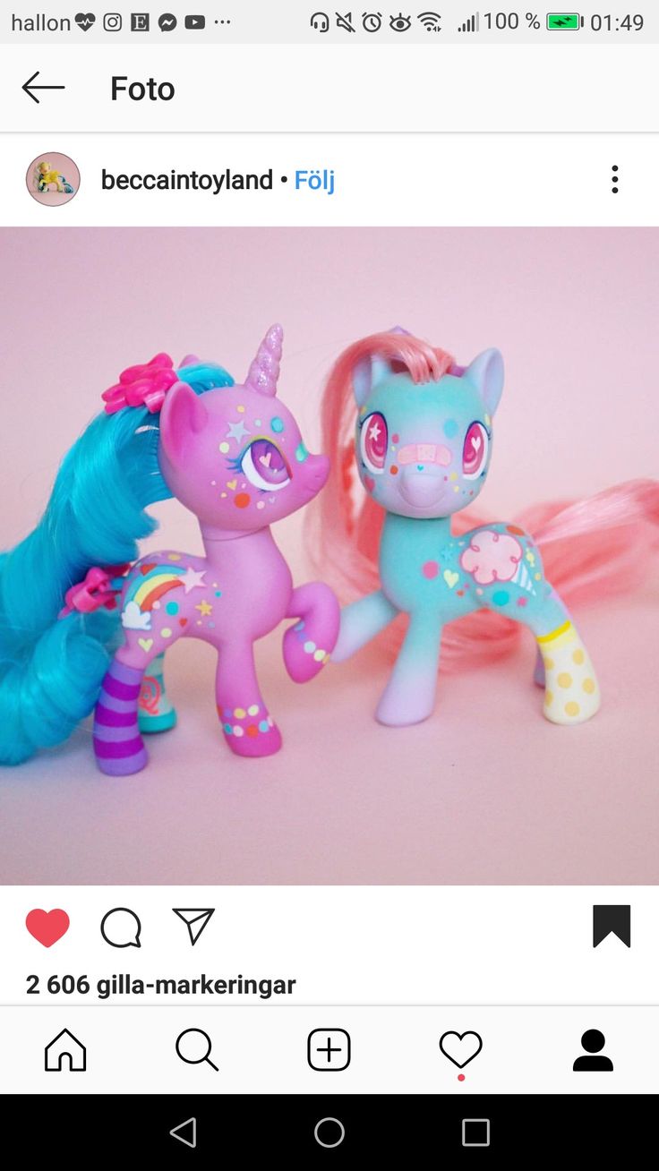 two little pony toys sitting next to each other