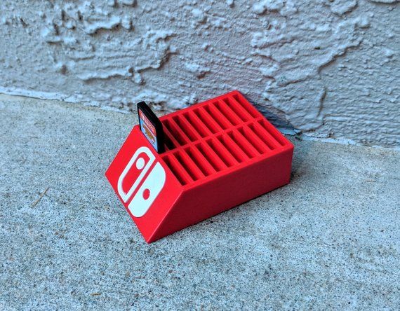 a red box with an instagram sticker on it sitting in front of a wall