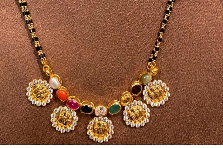 Navaratna Mangalsutra, Navaratna Necklace, Simple Necklace Designs, Black Beads Mangalsutra Design, Antique Gold Jewelry Indian, Online Gold Jewellery, Beautiful Gold Necklaces, Gold Mangalsutra Designs, Pearl Necklace Designs