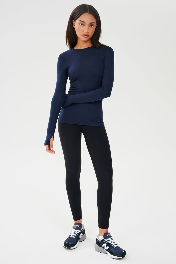 A semi-fitted long sleeve shirt that you can layer or wear alone. Super soft baby rib lays beautifully on the body. BEST FOR: running, yoga, CrossFit, barre, Pilates, spin class, cycling, court sports and gym workouts. Model is 5'10" and wears a size small. Barre Pilates, Running Yoga, Spin Class, Workout Crop Top, Yoga Tank Tops, Athletic Shirts, Soft Baby, Baby Soft, Hip Length