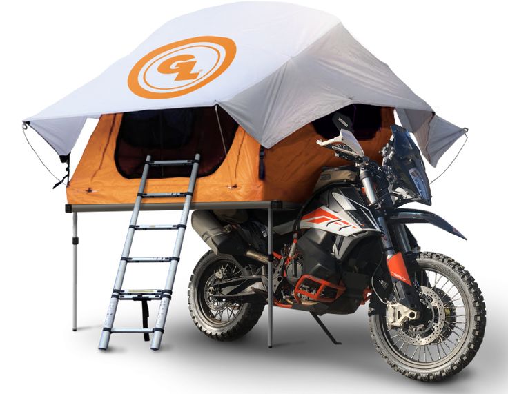 a motorcycle with a tent attached to it