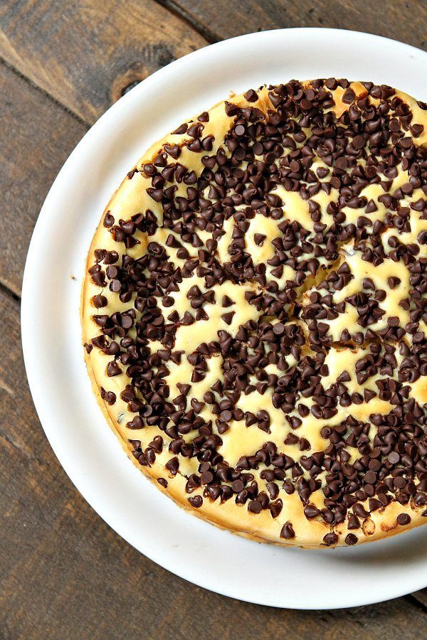 a chocolate chip cheesecake on a white plate