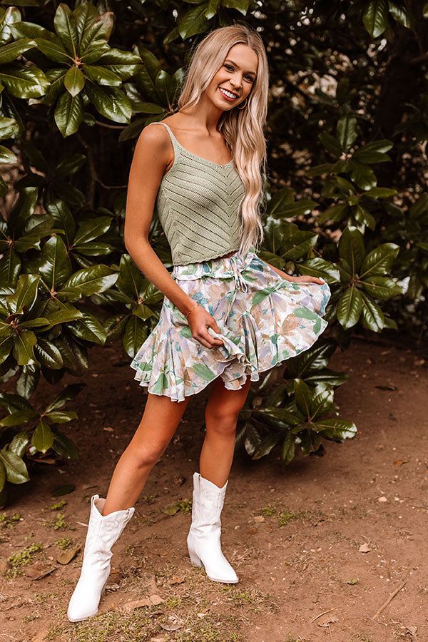 Take on any spring day in style with our flirty 'Daytona Daze Skort' featuring lightweight breezy material patterned with a green and mauve hued floral print, an elastic waistline with a tie closure, and a relaxed silhouette that ends in a ruffled upper-thigh length hemline! Plus, these cuties include sewn in shorts!  Measurements S variant has  a Hip of 30",  a Inseam of 2",  a Length of 15",  a Waist of 24".  M variant has  a Hip of 32",  a Inseam of 2",  a Length of 15",  a Waist of 26".  L v Beach Boardwalk, Scooped Neckline, Bondi Beach, Keep Cool, Model Fits, Knit Tank, Spring Day, Women Clothing Boutique, Knit Tanks