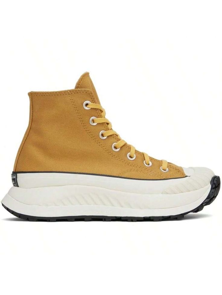 Converse 
Yellow Chuck 70 AT-CX Sneakers 
High-top cotton twill sneakers in yellow. Faux-leather logo patch at inner side. 
. Round textured rubber cap toe 
. Lace-up closure 
. Canvas lining 
. Padded CX foam footbed 
. Foam rubber platform midsole 
. Treaded rubber outsole 
. Platform: H1.5 in 
Supplier color: Burnt honey/Thriftshop yellow 
Upper: textile. Sole: rubber. 
Made in Viet Nam. 
231799M237062 
Yellow Chuck 70 AT-CX Sneakers default         Sports & Outdoor Shoes, size features are:B Burnt Honey, Converse Yellow, Casual Athletic Shoes, Chuck 70, Thrift Shopping, Leather Logo, Outdoor Shoes, High Top, Cotton Twill