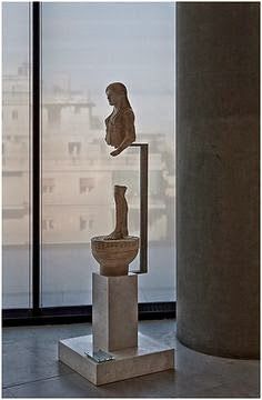 a sculpture is shown in front of a window